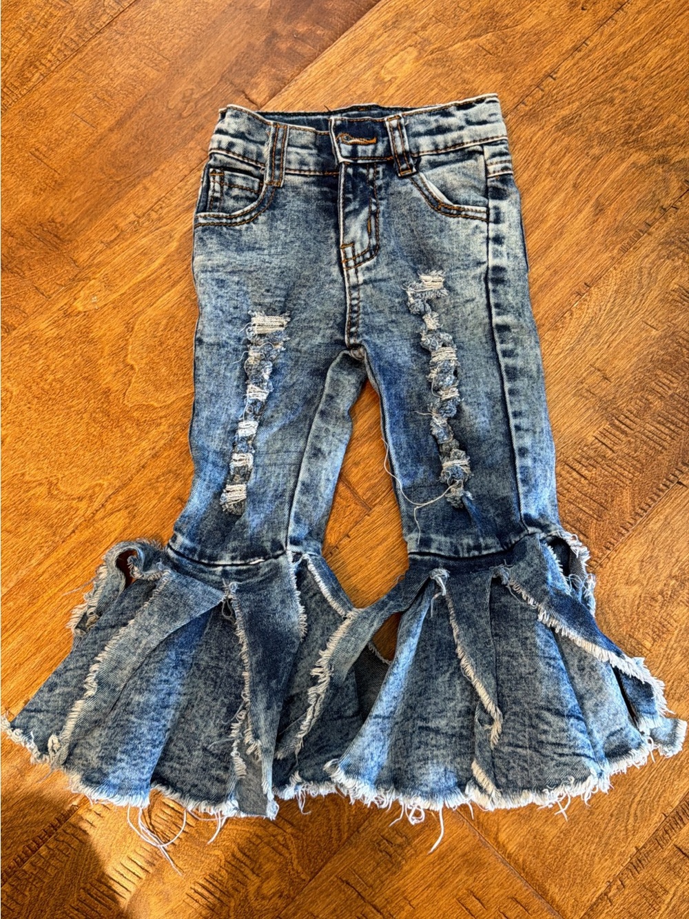 Girls Distressed Bell Bottom Jeans in Washed Blue